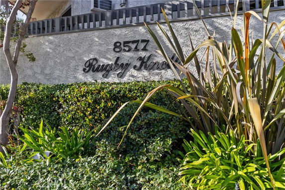 View of a building's exterior wall with the address and name 'Rugby Kino' displayed.