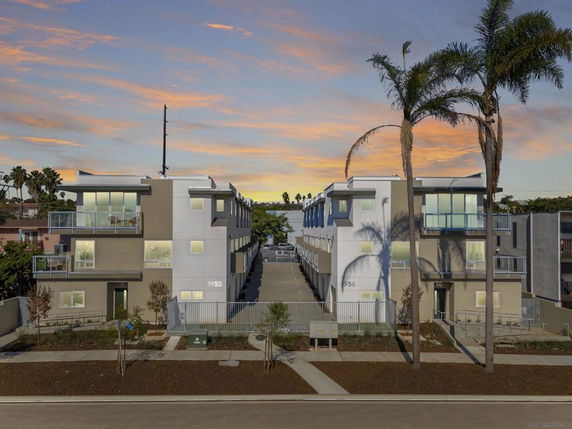 Front view of modern multi-story apartment buildings.