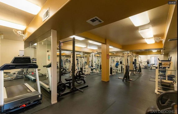 Indoor gym area with various fitness equipment.