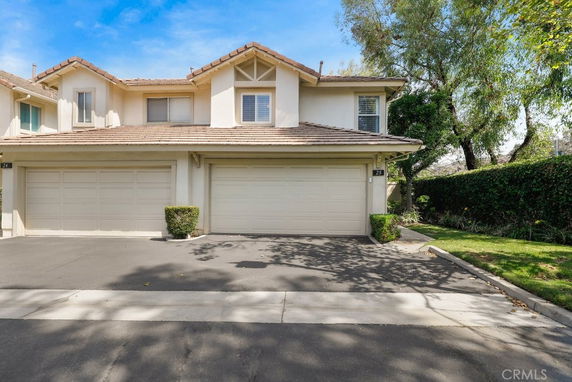 Front view of a two-story house with a double garage.