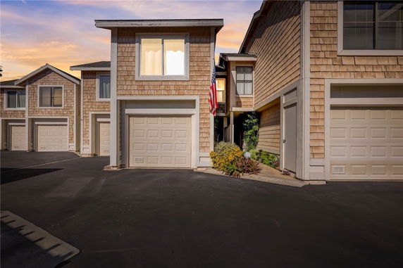 Front view of a two-story house with a garage.