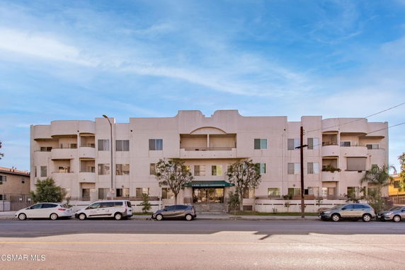Front view of a multi-story condominium building.