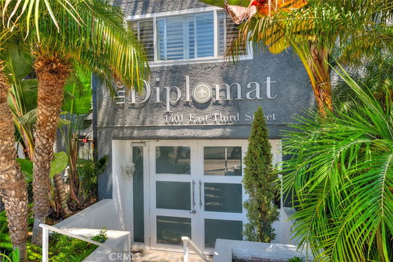 Front view of a building with the name 'The Diplomat' displayed.