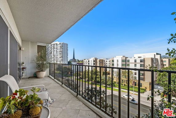 Balcony view overlooking urban apartment buildings