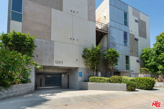 Front view of a multi-story building with modern architecture.