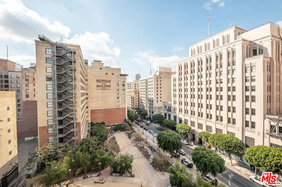 Urban area featuring multiple multi-story buildings, including the Rowan Building, with streets and trees.