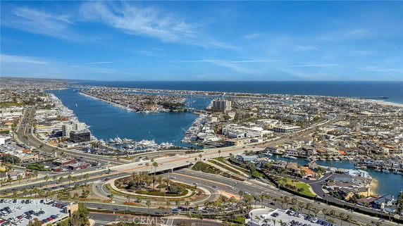 Panoramic view of a coastal city with waterways and buildings.
