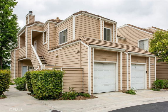 Front view of a multi-story house with a double garage.