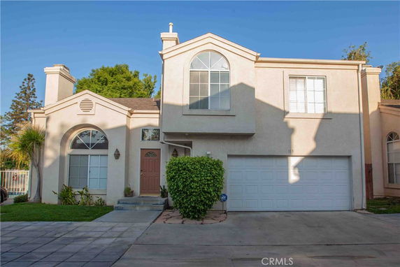 Front view of a two-story house with a double garage.
