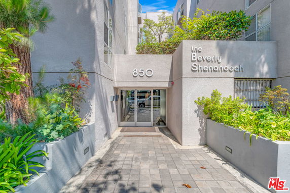 Front view of a building entrance with the name 'The Beverly Shenandoah' and the number 850.