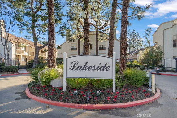Front view of a residential building complex with a sign reading 'Lakeside'.