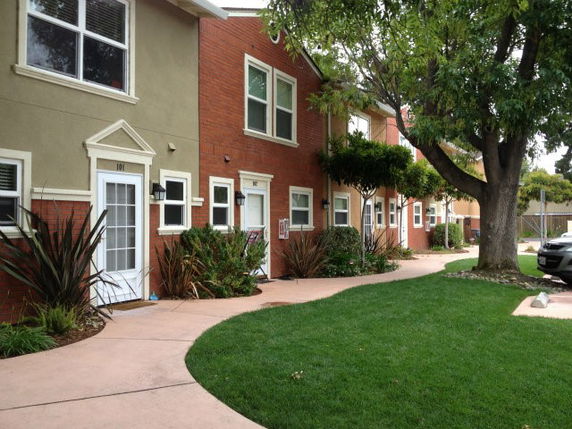 Front view of a two-story building with multiple entrances.