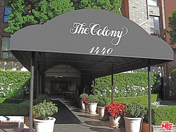 Entrance of a building with a canopy labeled 'The Colony' and address number 1440.