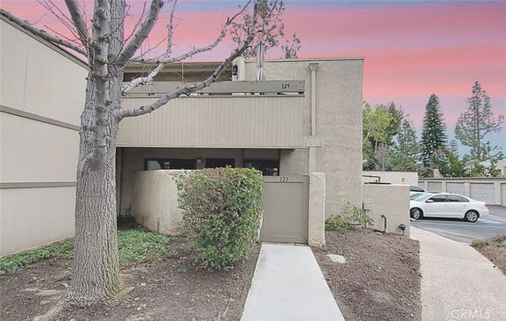 Front view of a two-story building with a flat roof and minimalistic design.
