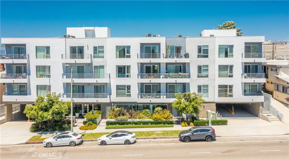 Front view of a modern multi-story apartment building.