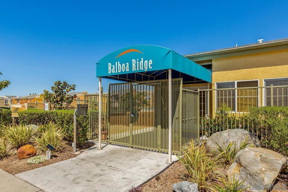 Entrance view of a building with a gated entryway and canopy labeled 'Balboa Ridge'.