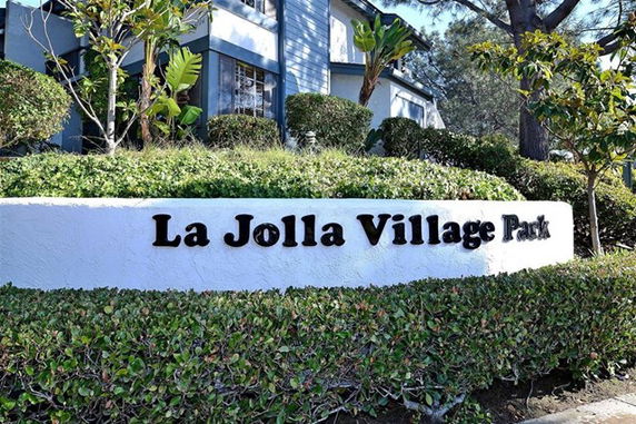 Front view of a residential building with a sign saying 'La Jolla Village Park'.