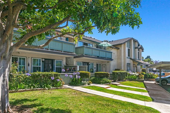 Front view of a two-story residential building with balconies.
