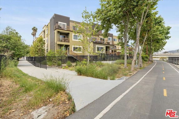 Front view of a modern multi-story residential building.