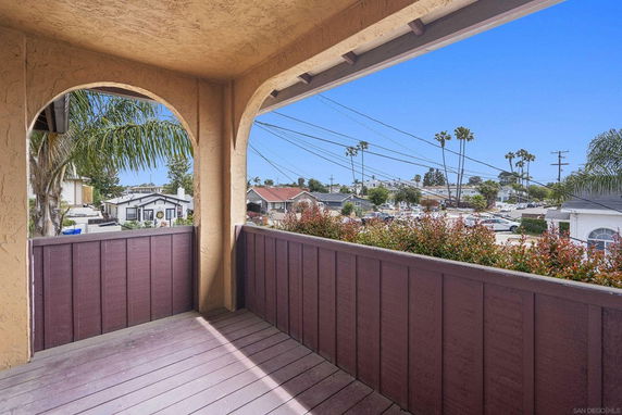 View from a balcony overlooking a residential neighborhood.