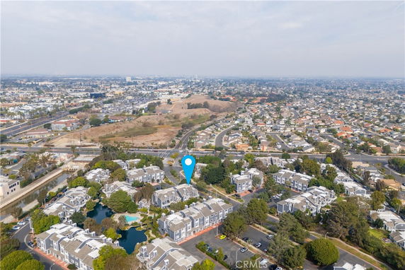 Aerial view of residential area with multiple buildings and roads.