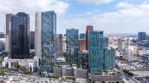 Aerial view of a city skyline with multiple tall buildings and skyscrapers.