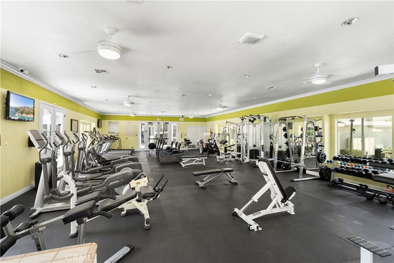 Interior view of a gym with various exercise equipment and machines.
