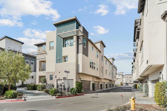 Front view of modern multi-story residential buildings.