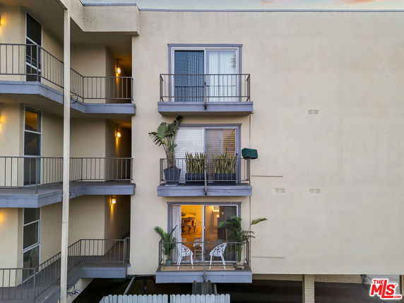 Front view of an apartment building with balconies.