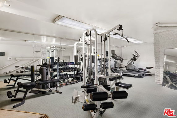 Indoor view of a gym area with various exercise equipment.