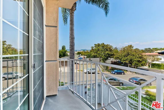 View from a balcony overlooking a residential street.