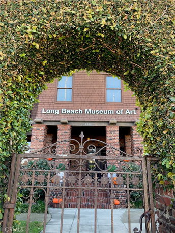 Front view of the Long Beach Museum of Art with a brick facade and arched entrance.