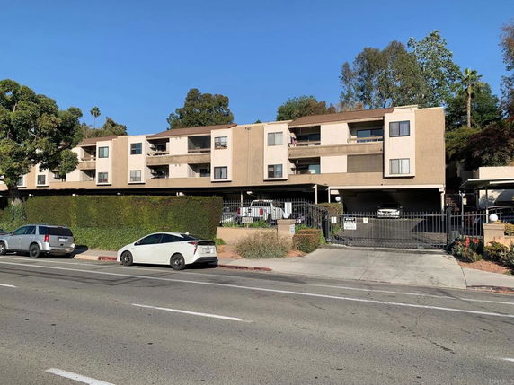 Front view of a multi-story apartment building.