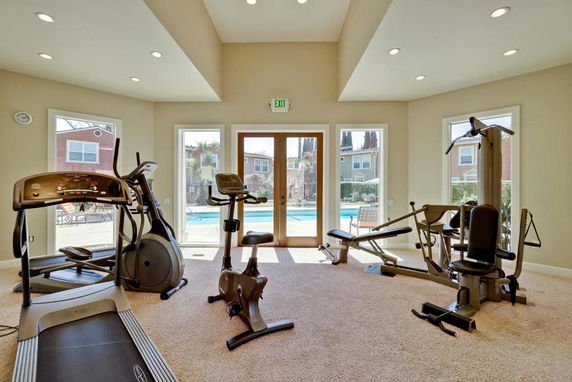 Interior view of a gym area with exercise machines.