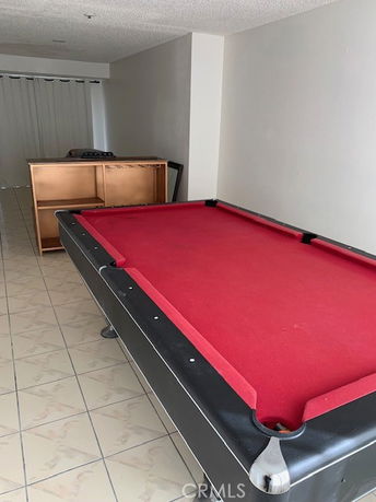 Room with a red pool table.