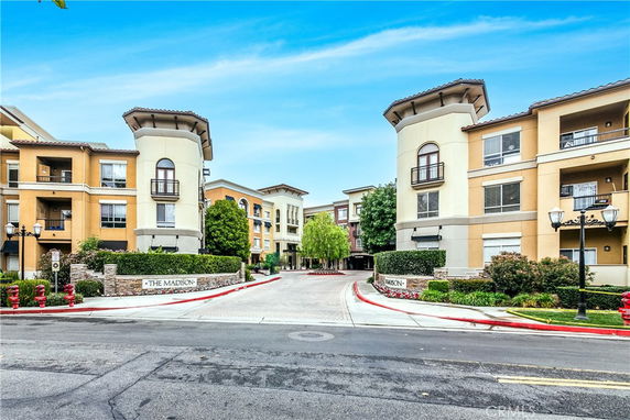 Front view of a multi-story apartment building complex.
