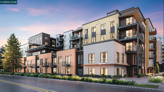 Front view of a modern multi-story apartment building with balconies.