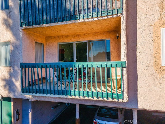 Front view of a multi-story building with balconies.