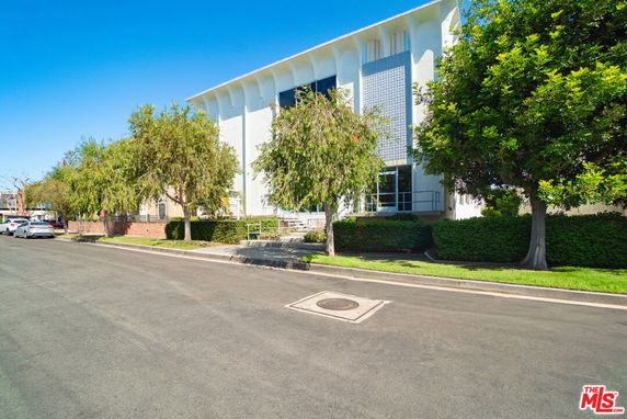 Front view of a two-story building with modern design elements.