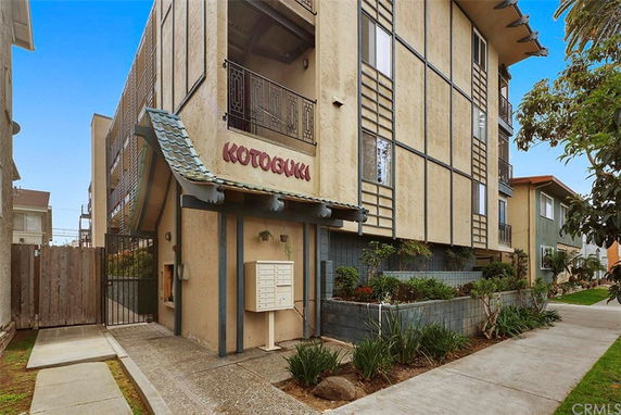 Front view of a multi-story building with a unique architectural design.
