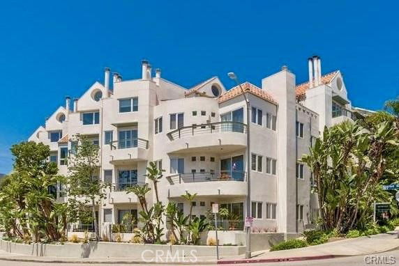 Front view of a multi-story modern apartment building.