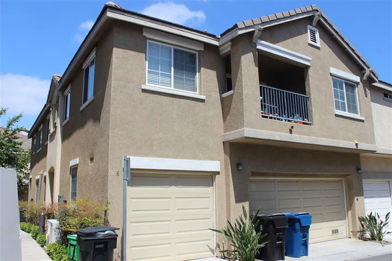 Front view of a two-story house with a double garage.