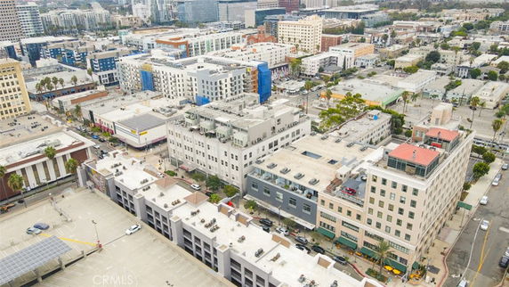 Panoramic view of urban area with multiple multi-story buildings.