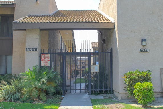 Front view of a building with a gated entrance.
