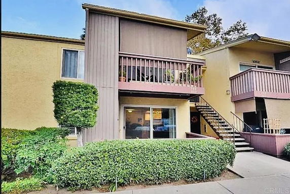 Front view of a two-story residential building with balconies.