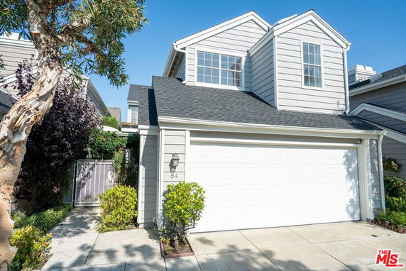 Front view of a two-story house with a double garage.