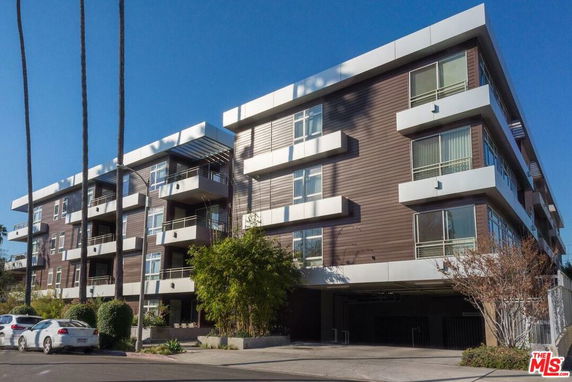 Front view of a modern multi-story apartment building.