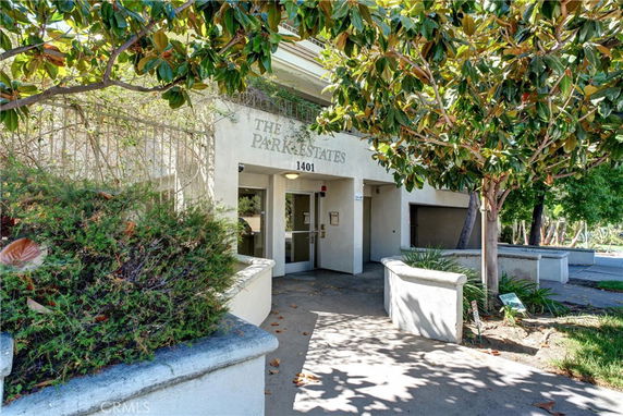 Front view of a building entrance with the name 'The Park Estates' above the doorway.