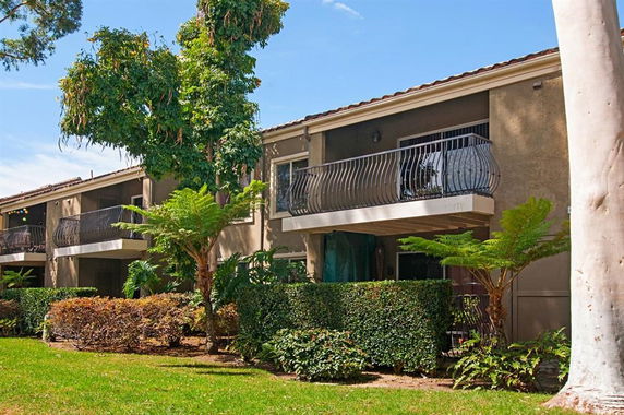 Front view of a two-story residential building with balconies.
