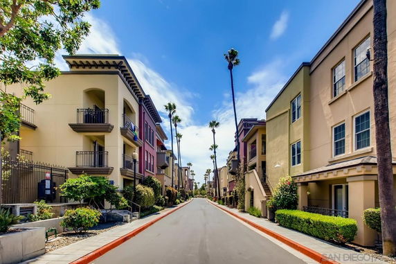 Street view with residential buildings on both sides.